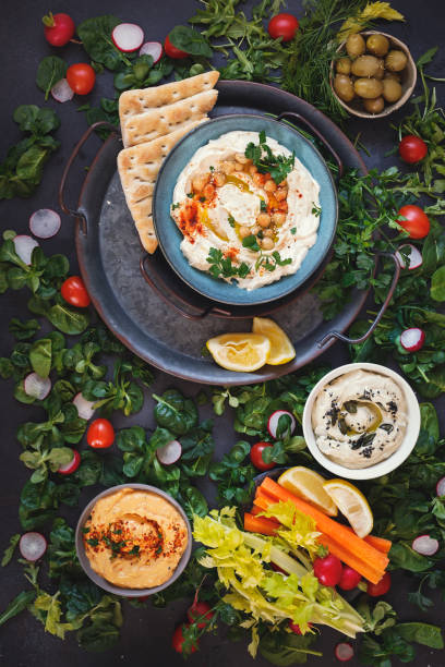 istock Various vegetarian dips served with fresh vegetables and pita bread 1305148927