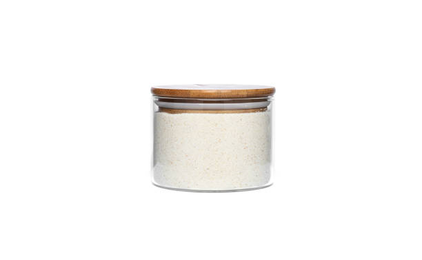 istock Semolina in a glass jar isolated on a white background 1305152124