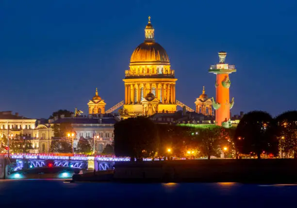 St. Isaac's cathedral dome, Rostral column and Palace bridge at night, Saint Petersburg, Russia