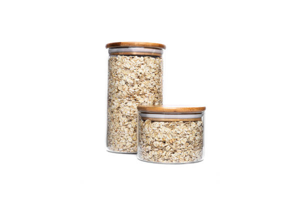 istock Oat flakes in a glass jar isolated on a white background 1305157841