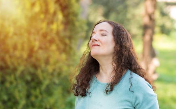 istock Woman breathing fresh air 1305158180