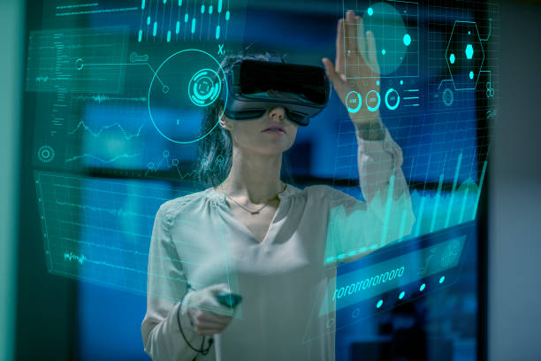 istock Woman wearing a VR headset at work 1305158908