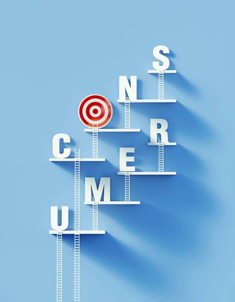 istock Consumerism Concept - White Ladders Leaning Over A Bull's Eye Target And Writing Consumer On Blue Wall 1305160072