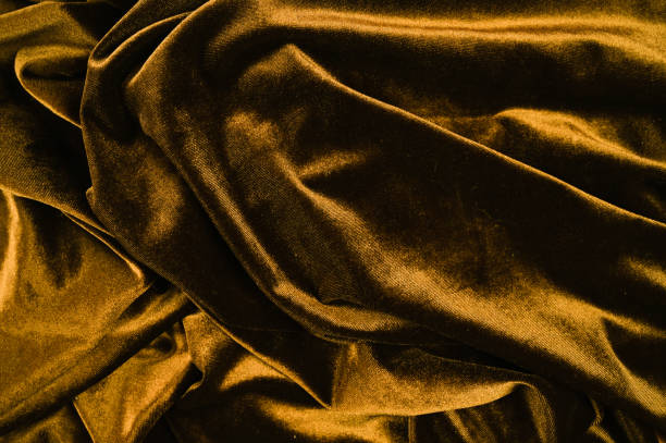 istock Texture of yellow velor crumpled fabric 1305160119