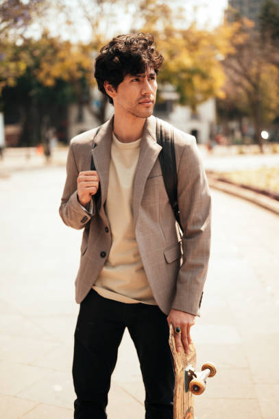 istock Portrait of beautiful young man skateboard 1305160965