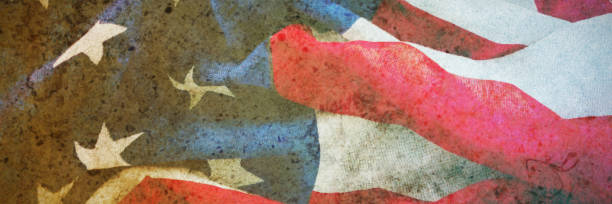 istock Crumbled American flag on wooden table 1305161248