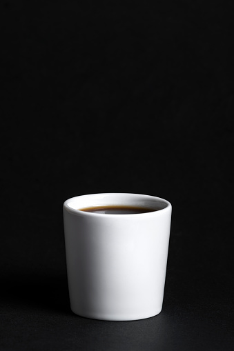 Empty coffee cup or coffee mug isolated on black background