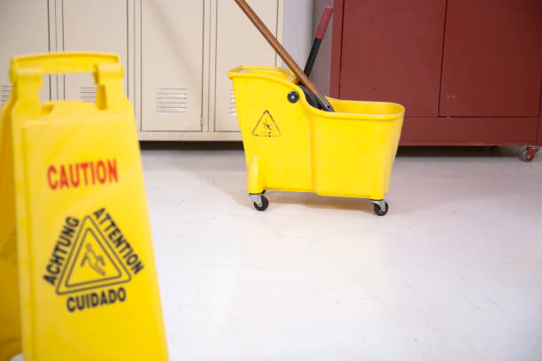 istock Janitor getting ready to mop floor in school locker room. 1305162350