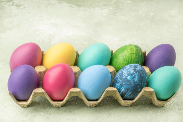 istock colorful easter eggs on green background with copy space 1305163266