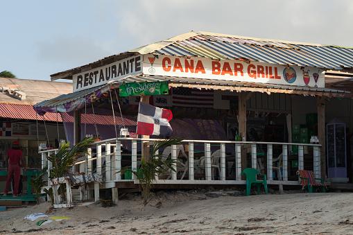 Punta Cana, Dominican republic - January 13, 2020: Cana Bar Grill, beach restaurant on a beach of Punta Cana resort. Ordinary people are nearby