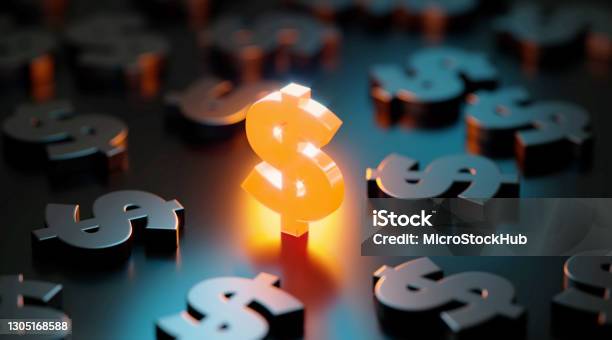 Us Currency And Finance Concept Yellow American Dollar Sign Glowing Amid Black American Dollar Signs On Black Background Stock Photo - Download Image Now
