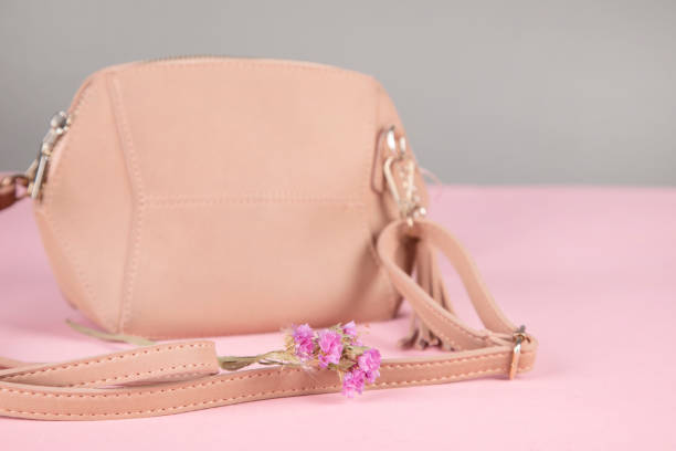 istock pink bag with flower on pink background 1305169582