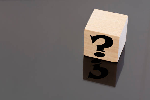 istock a question mark on a wooden cube . FAQ frequency asked questions, Answer, Information and Brainstorming Concepts 1305169743