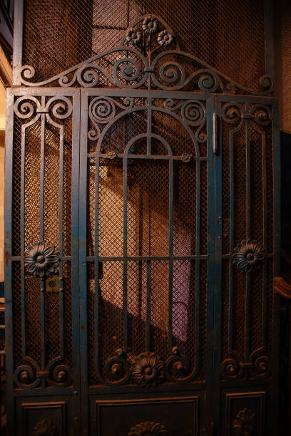istock Old vintage rusty elevator gates in old mansion 1305170184