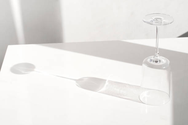 istock empty transparent wine glass and reflection on white background 1305171830
