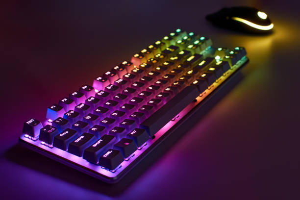 istock RGB gaming keyboard. Bright colorful keyboard with mouse, neon light. Mechanical keyboard with RGB light 1305173858