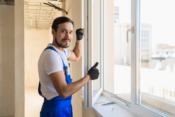 istock The young adjuster stands at the open window 1305177119
