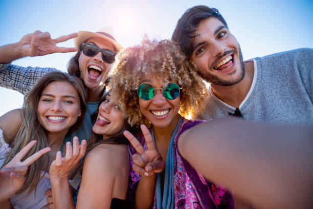 istock Group of friends having fun taking a selfie. 1305182356