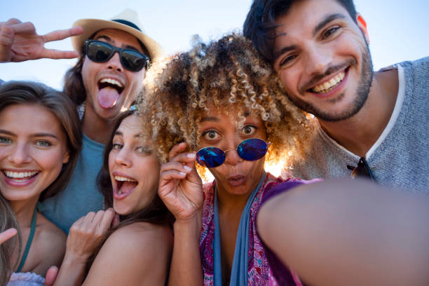 istock Group of friends having fun taking a selfie. 1305182364