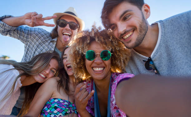 istock Group of friends having fun taking a selfie. 1305182365