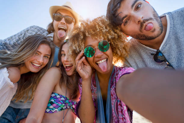 istock Group of friends having fun taking a selfie. 1305182366
