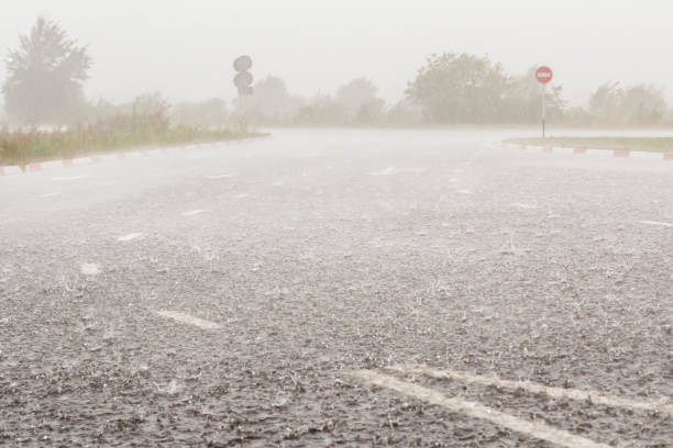 istock Heavy rain with hail is falling along the highway. 1305184504