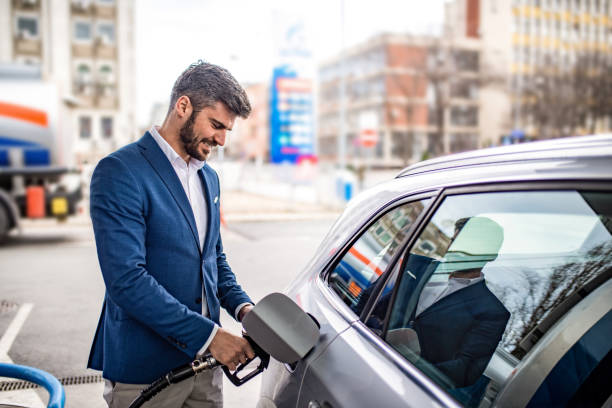 istock Happy man at the gas station. 1305185874