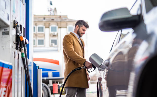 istock Happy man at the gas station. 1305185943