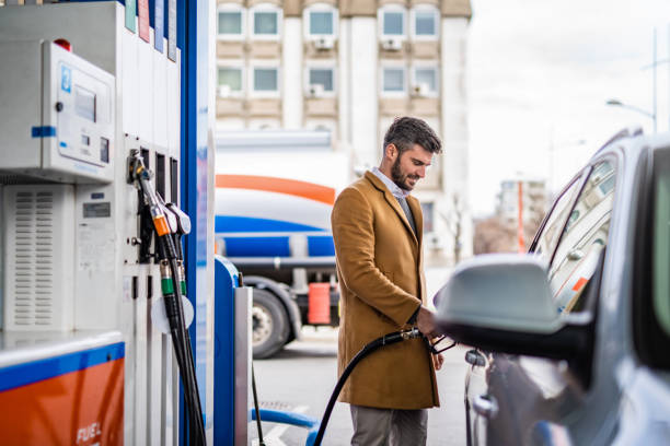 istock Happy man at the gas station. 1305185965