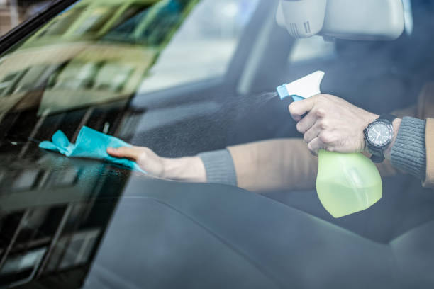 istock Unrecognizable man cleaning his car interior. 1305187042