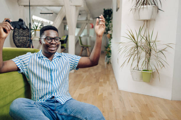 istock Young African American gaming and cheering 1305189058