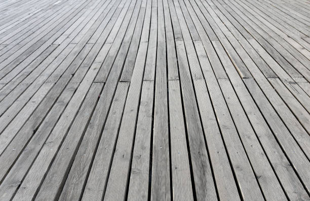 istock Wooden floor perspective background 1305189151