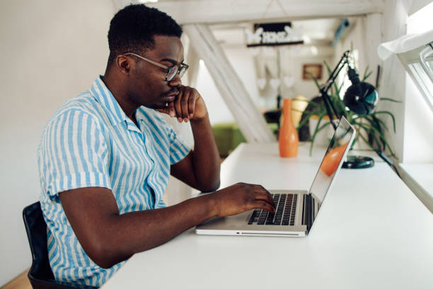 istock Young African-American entrepreneur concentrated on working 1305189518