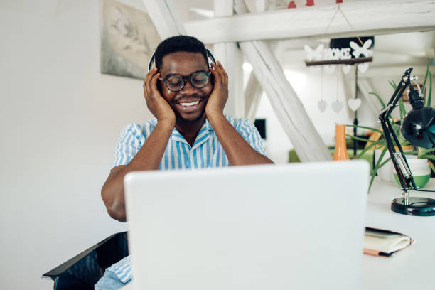 istock Young African American man enjoying music after work 1305189548