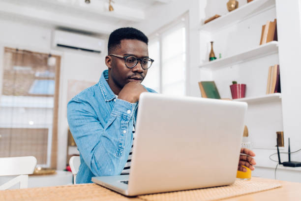 istock African-American freelancer working from home office 1305189601