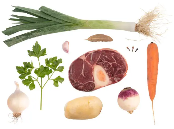 Ingredients of the French pot au feu on a white background