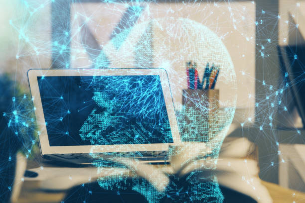 istock Double exposure of desktop computer and human brain drawing hologram. Ai concept. 1305197218