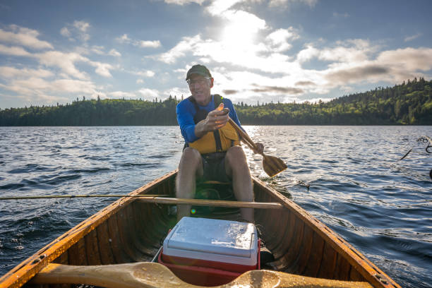 istock Senior man fishing. 1305208512