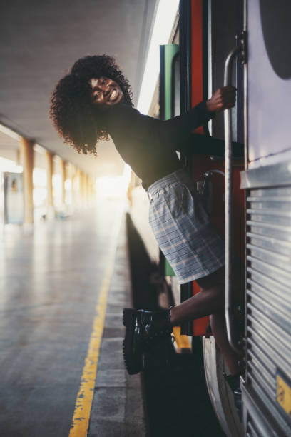 istock A laughing black girl entering train 1305209140