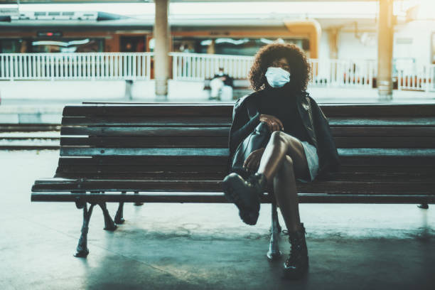 Black girl on the platform bench