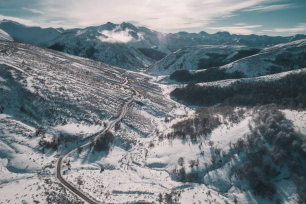 istock sunrise in high mountain road from aerial view 1305212569