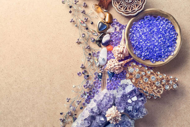 istock Beautiful stones, crystals, minerals, and other materials on a cardboard textured surface. Magic crystals and products. 1305214995