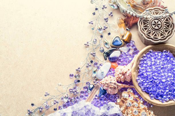 istock Beautiful stones, crystals, minerals, and other materials on a cardboard textured surface. Magic crystals and products. 1305215018