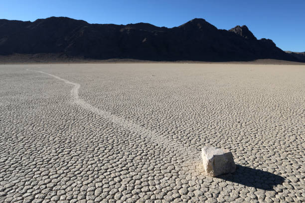 Sailing Rock at Racetrack Playa in Death Valley Sailing Rock at Racetrack Playa in Death Valley National Park death valley desert photos stock pictures, royalty-free photos & images