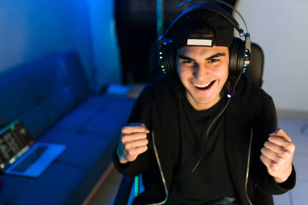 istock Latin man winning a match and screaming during a live stream 1305223996