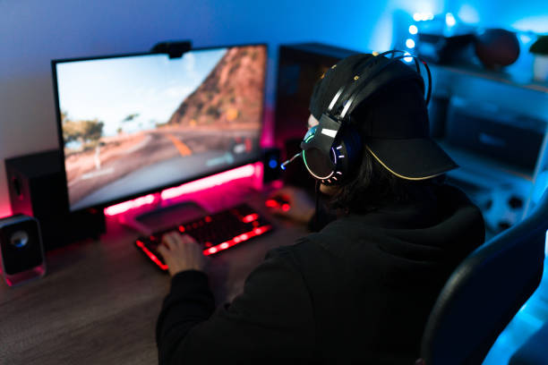 istock Hispanic man having fun and enjoying a videogame 1305224879