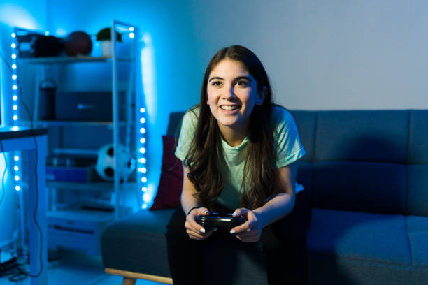 istock Caucasian woman gaming with a remote controller 1305225243