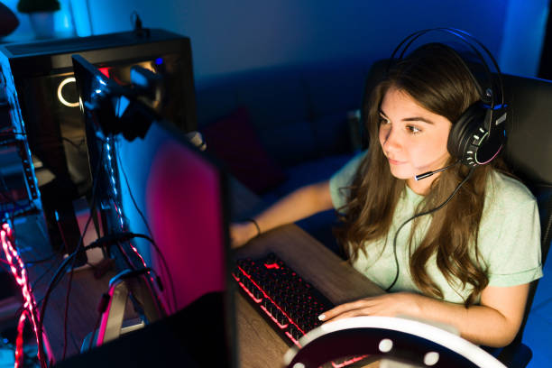 istock Excited woman gamer winning on a videogame while live streaming 1305225270