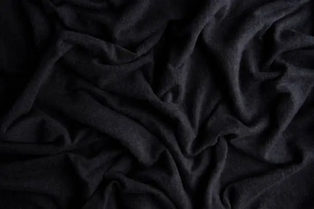 Photo of Grooved of black fabric abstract