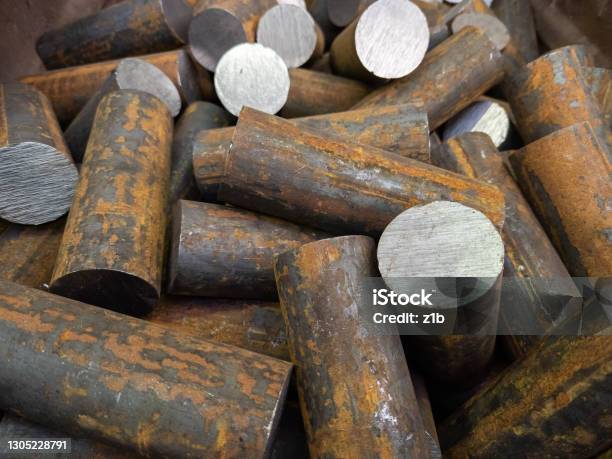A Pile Of Raw Steel Short Rods Cutted By Saw Workpieces Prepaired For Forging Closeup With Selective Focus Stock Photo - Download Image Now